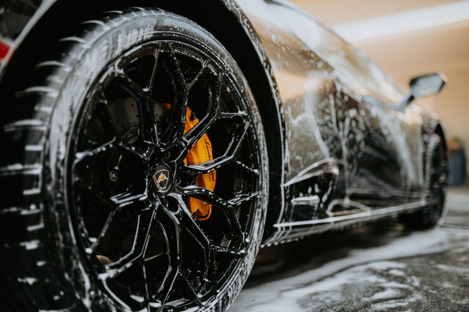 Luxury car receiving a premium foam wash